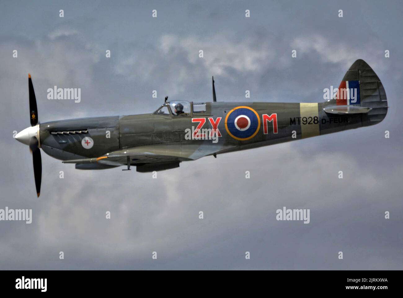 Spitfire MK VIII MT9284 side view in flight historic fighter airplane, Stock Photo