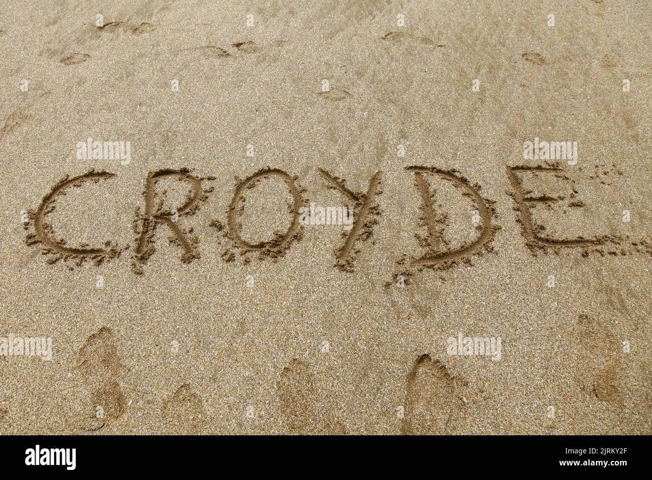 Croyde written in sand on beach, Croyde Bay, North Devon, England, UK, Summer August 2022 Stock Photo