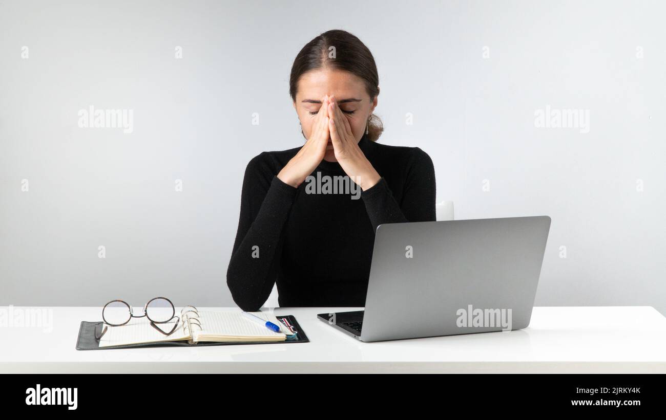 Tired woman after hard work at the laptop. High quality photo Stock Photo