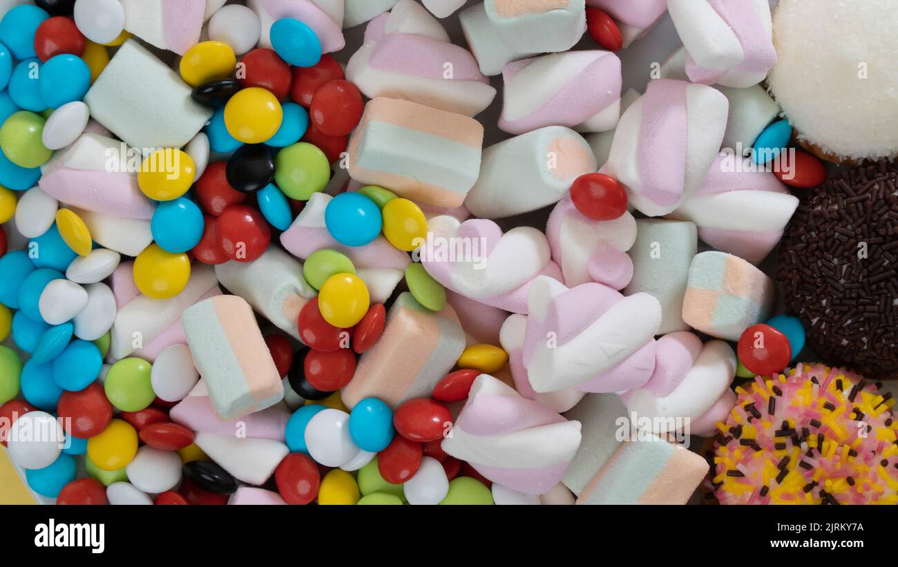 Sweets, dragees, marshmallows, cakes close-up - a background of sweets. High quality photo Stock Photo