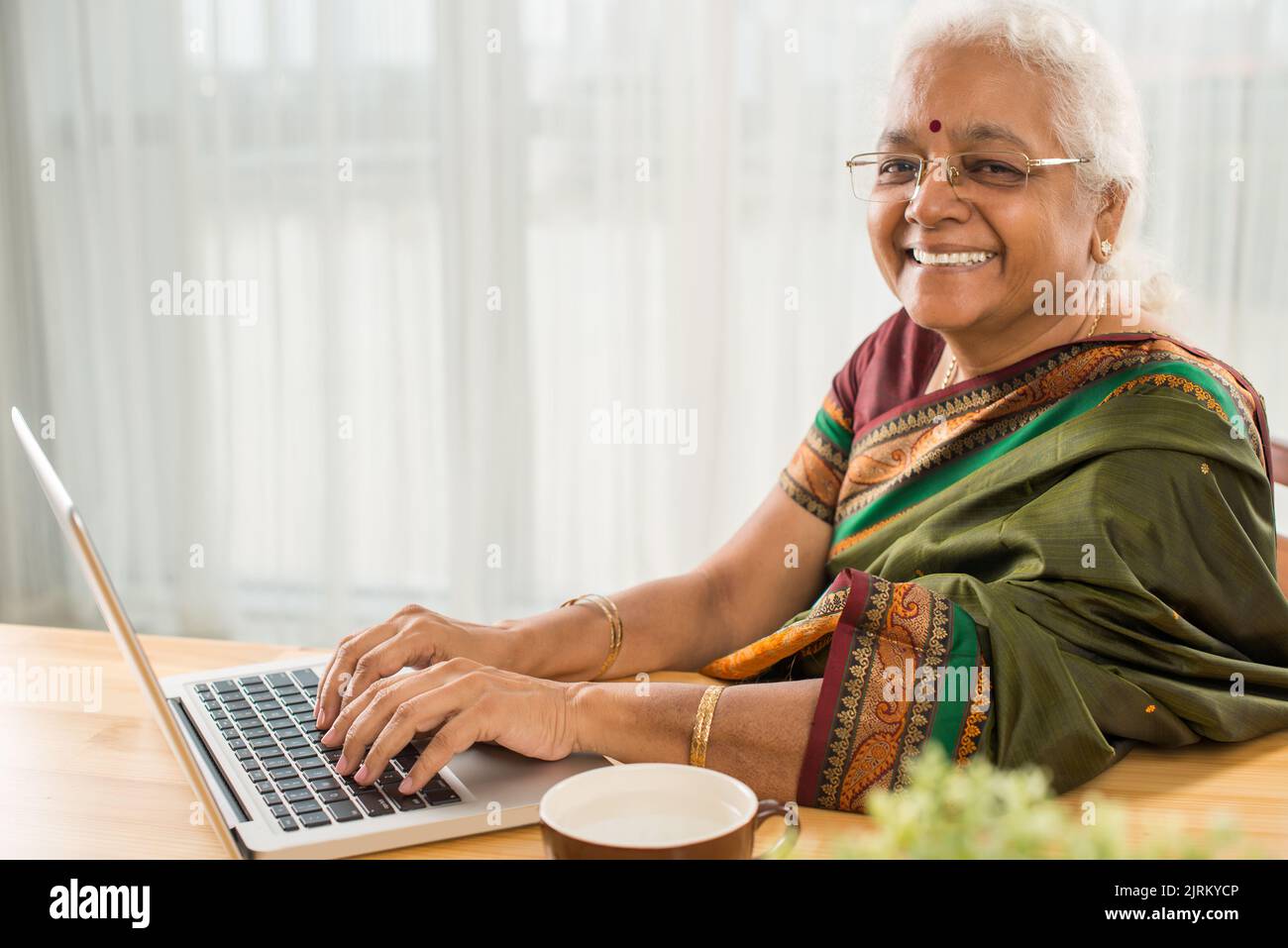 Indian woman working on laptop hi-res stock photography and images - Alamy