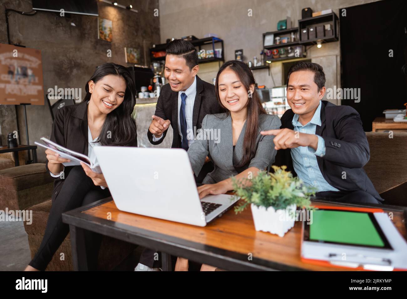 business people meeting in a cafe using laptop Stock Photo