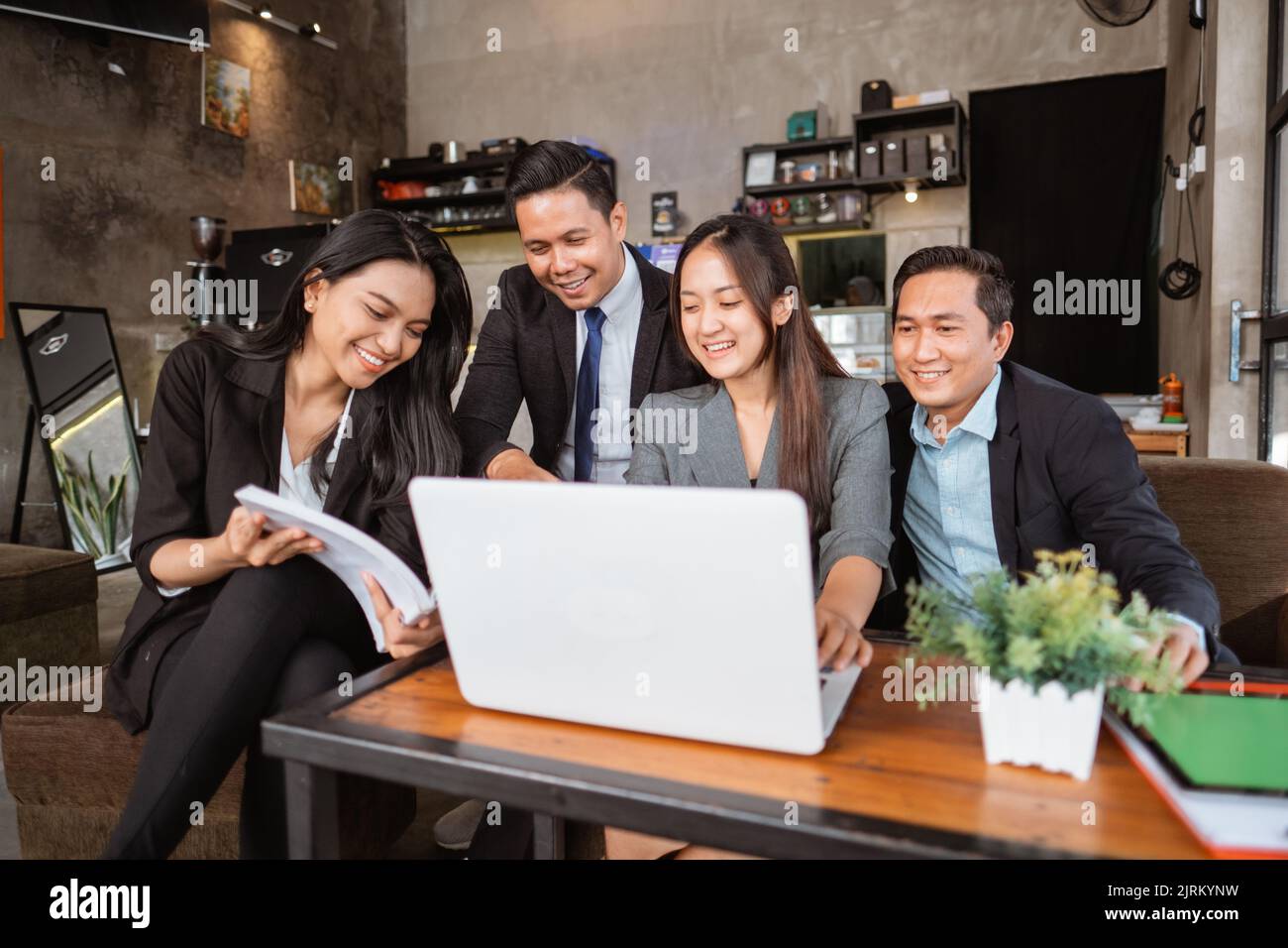 business people meeting in a cafe using laptop Stock Photo