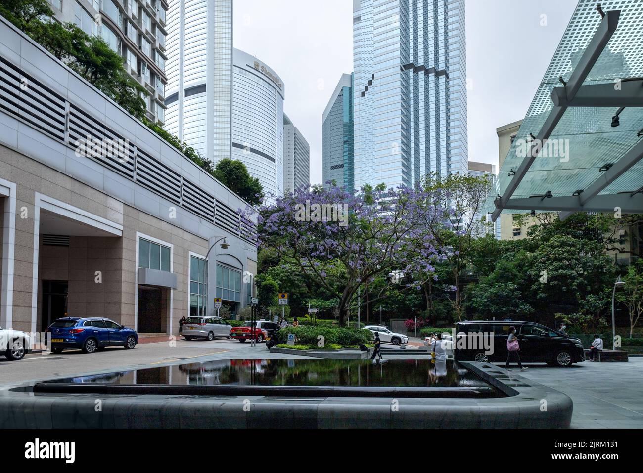 A roundabout with cars outside office space in the Central Business District in Hong Kong Stock Photo