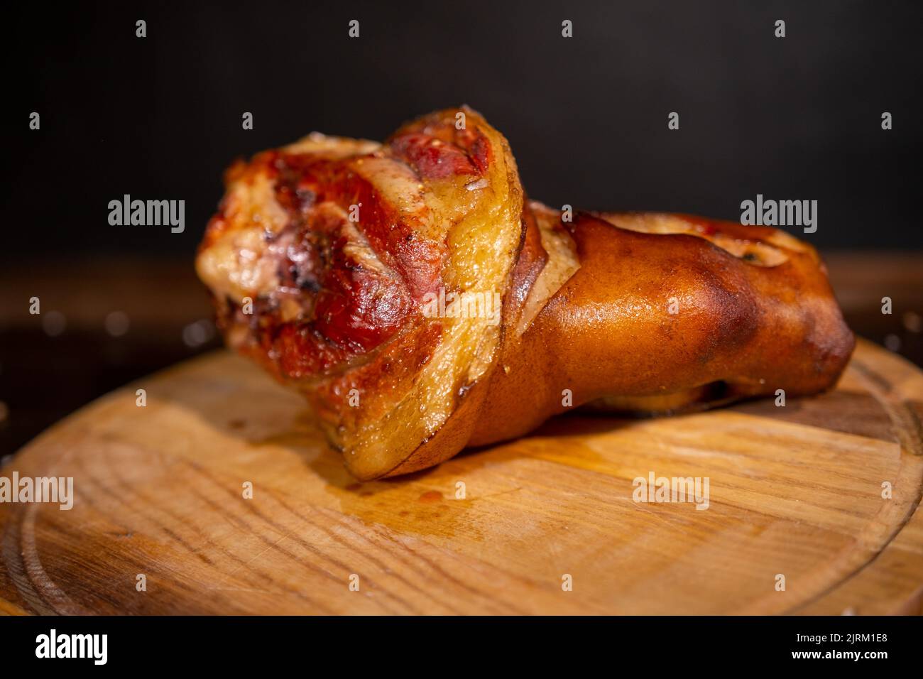 Big smoked pork knuckle, delicious food, appetizer. Bavarian grilled knuckel of pork - German Pork Hocks. space for text. top view. Stock Photo
