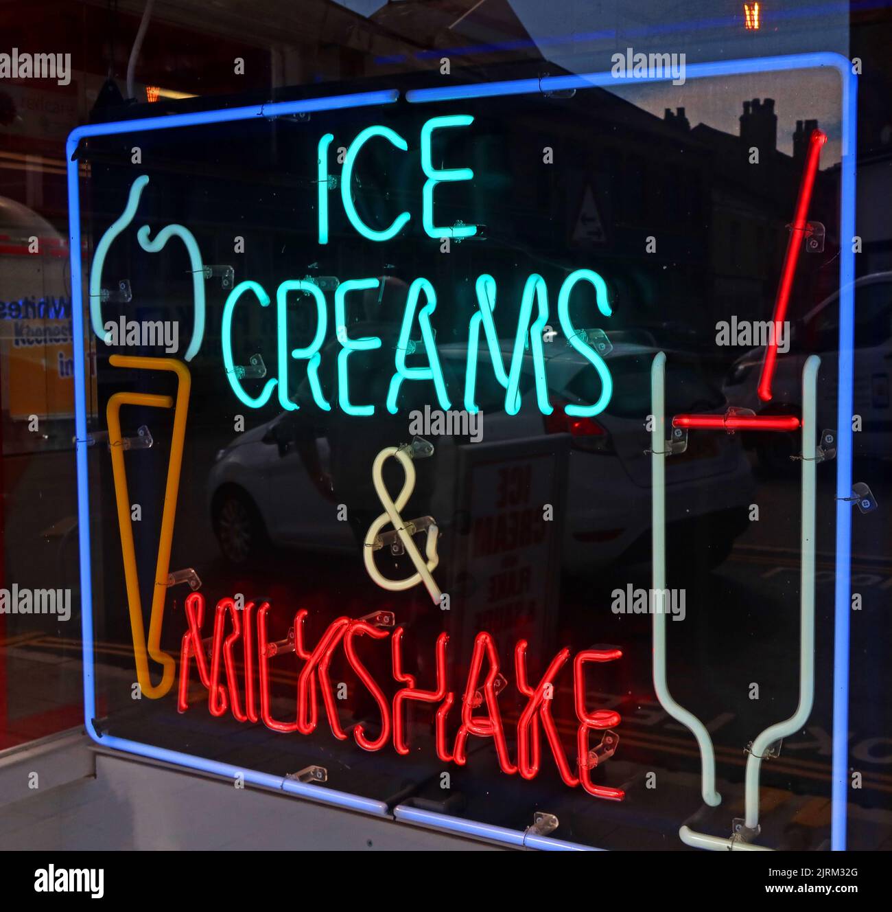 Ice Creams & Milkshake neon advertising sign , in a cafe, Waterloo Road, Blackpool, Lancashire, England, UK, FY4 Stock Photo