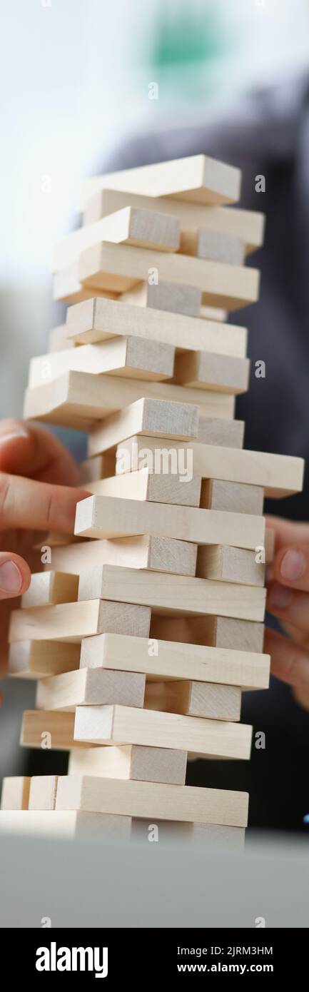 Man removing wooden block hi-res stock photography and images - Alamy