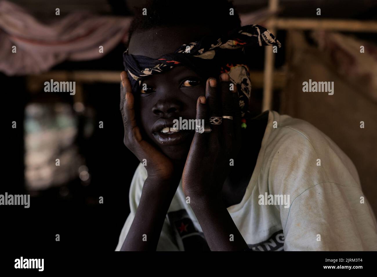 South Sudanese boy who returned to Khartoum after the 2011 secession, live in a makeshift shelter in an abandoned plot of land in Bahri, Sudan, August 12, 2022. REUTERS/Mohamed Nureldin Abdallah Stock Photo