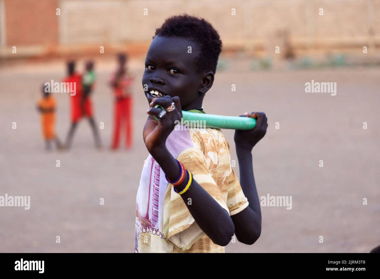 South Sudanese boy who returned to Khartoum after the 2011 secession, looks on while he lives in a makeshift shelter in an abandoned plot of land in Bahri, Sudan, August 15, 2022. REUTERS/Mohamed Nureldin Abdallah Stock Photo