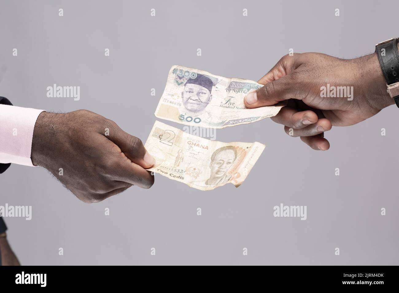 Two People Exchanging Naira And Cedi Stock Photo Alamy two-people-exchanging-naira-and-cedi-stock-photo-alamy
