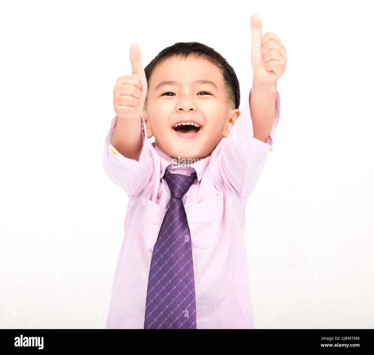 Happy Boy in a suit and showing thumbs up isolated on white background Stock Photo