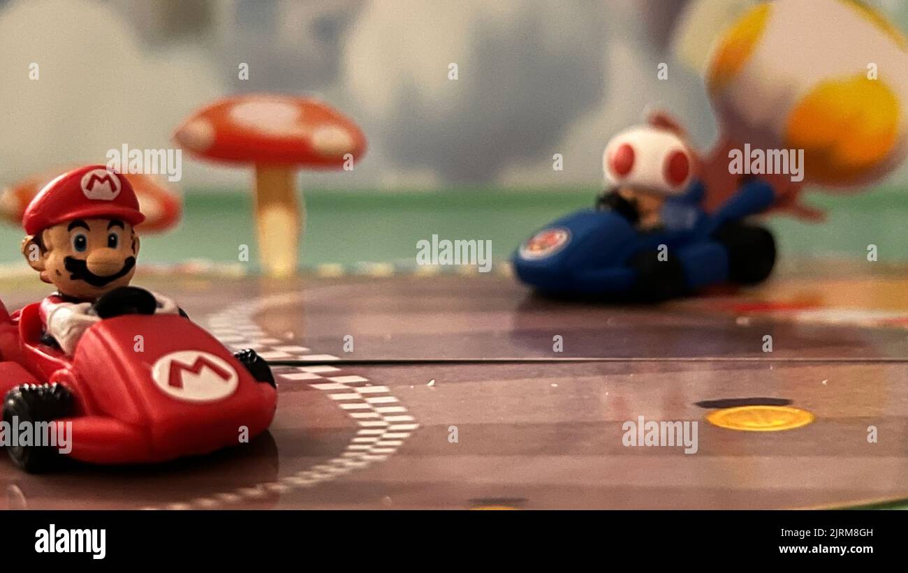 A closeup shot of  Mario karts from the game monopoly Mario kart with blurred background Stock Photo