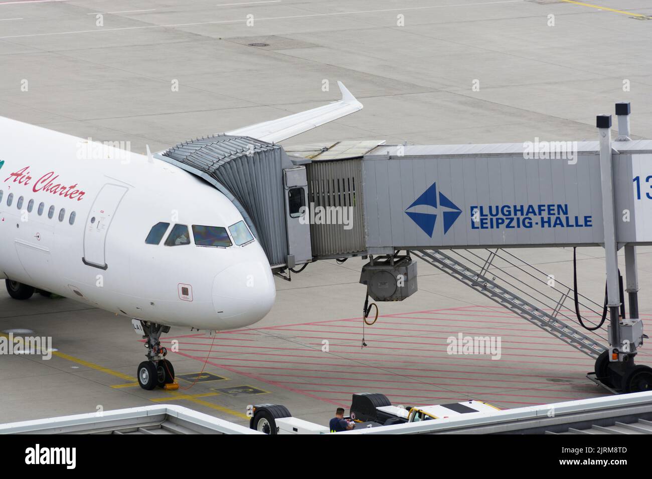 Germany, August 25, 2022: Gangway at passenger aircraft at Leipzig-Halle Airport Stock Photo