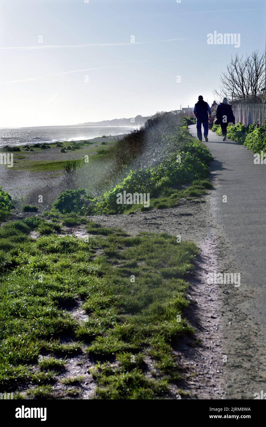 older couple on coastal walk pakefield suffolk england Stock Photo