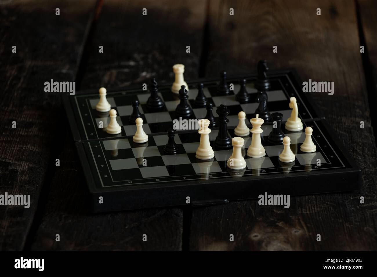 brown chess board with figures on a wooden table in a cafe, playing chess  Stock Photo - Alamy