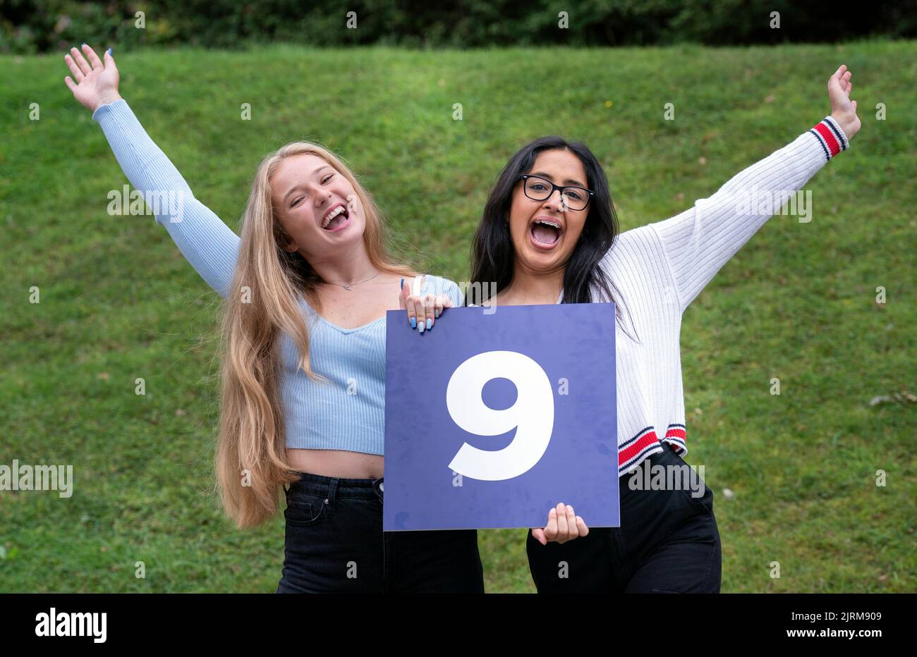 (left to right) Molly Fearn and Aminah Majid celebrate after receiving their GCSE results at The Grammar School in Leeds, Yorkshire. Picture date: Thursday August 25, 2022. Stock Photo