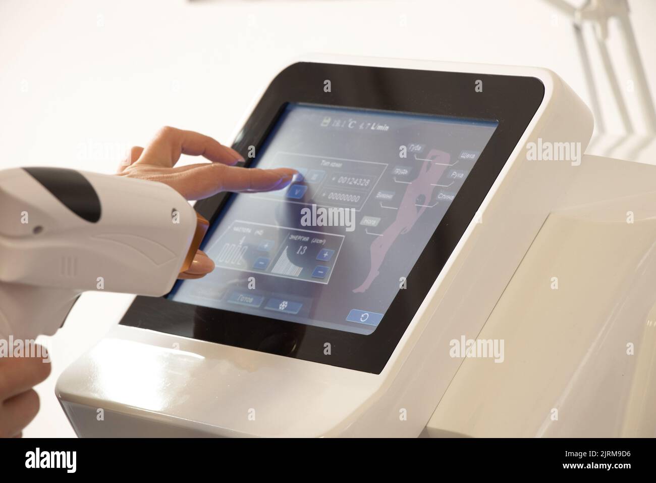 apparatus for daser hair removal in Russian, screen settings of the laser hair removal apparatus in the cosmitology office Stock Photo