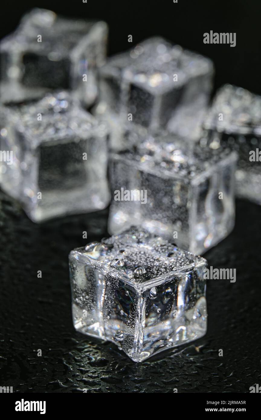 Multiple frozen ice cubes on a Black background Stock Photo
