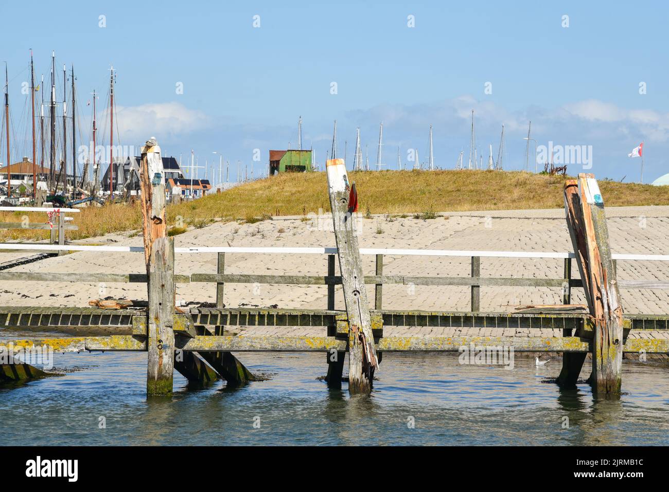 Texel, Netherlands. August 2022. Broken mooring posts in the harbor of Oudeschild. High quality photo Stock Photo