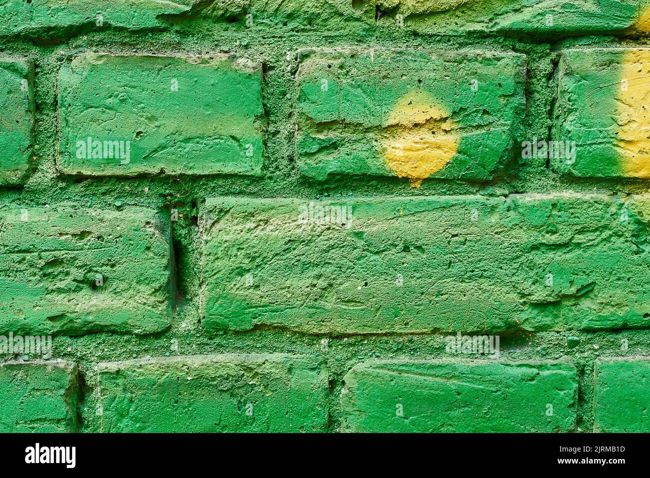 Green brick wall, grunge background. Copy space for text. Stock Photo