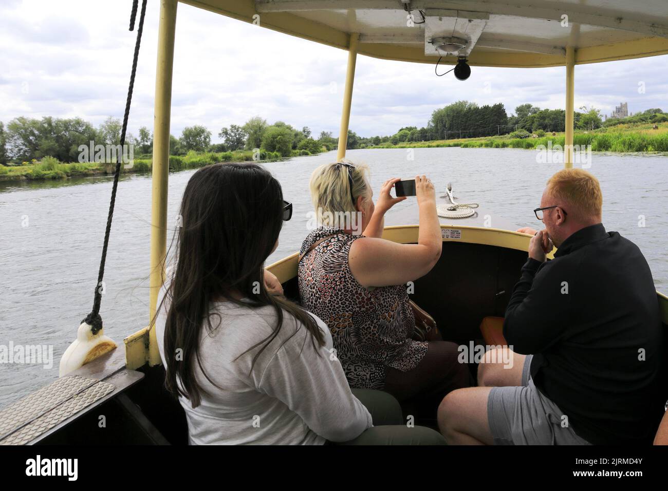 The Liberty Belle tourist boat on the river Great Ouse embankment, Ely