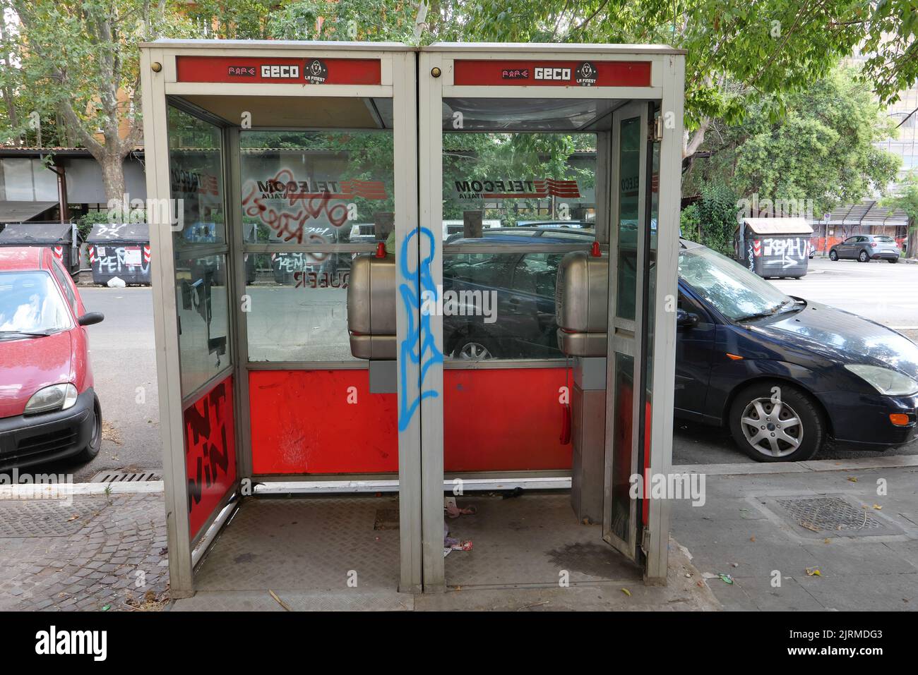 TWO TELECOM TELEPHONE BOOTHS NOW IN DISUSE Stock Photo