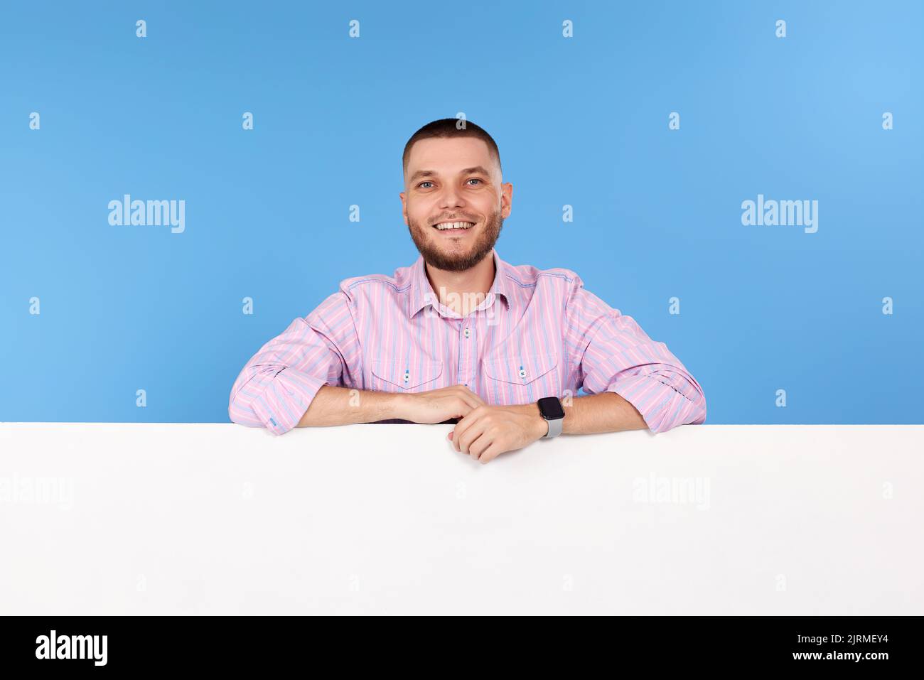 cheerful man holding board with empty copy space Stock Photo