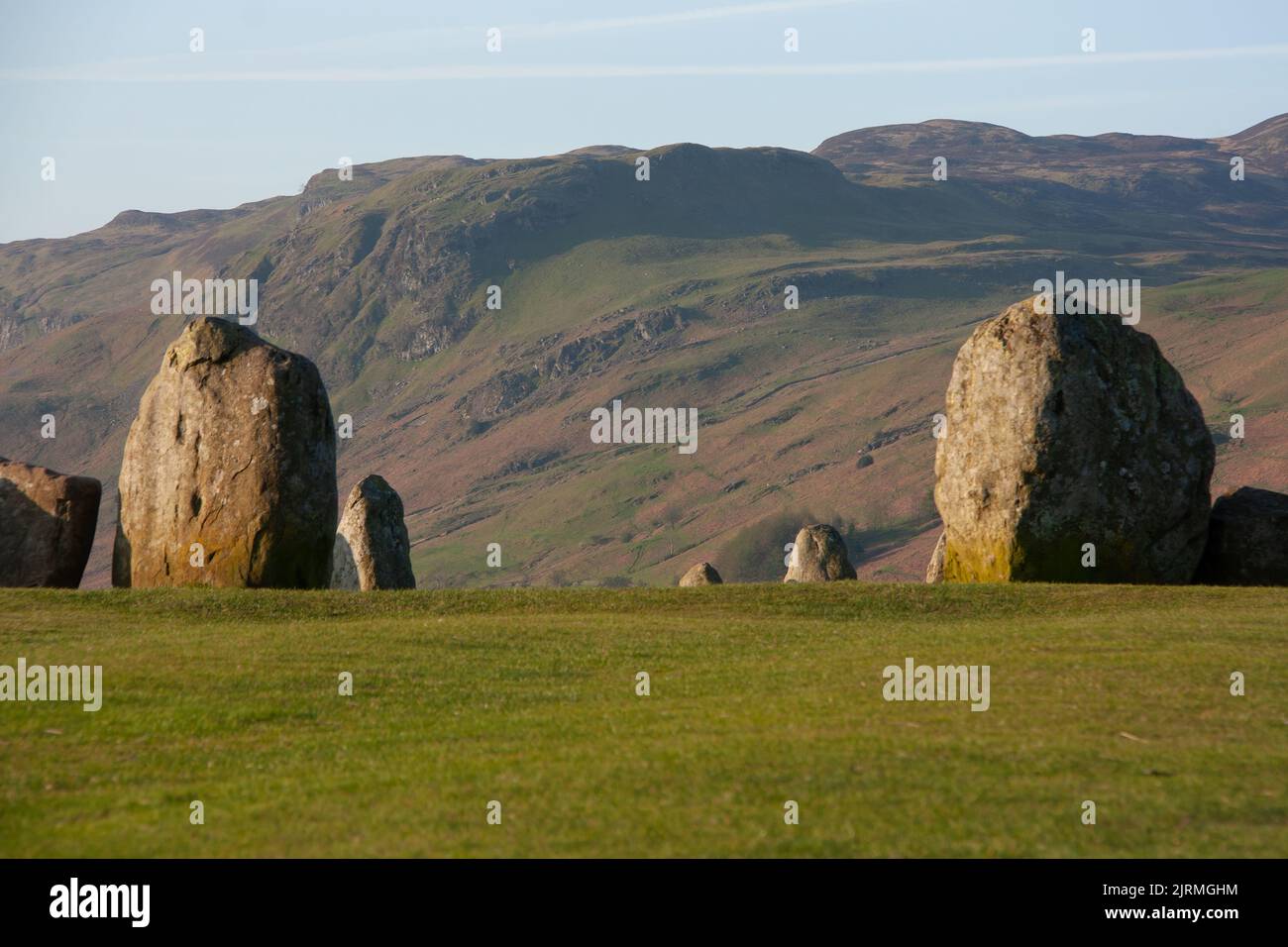 The view of megalithic Castlerigg stone circle in the green field under the blue sky Stock Photo