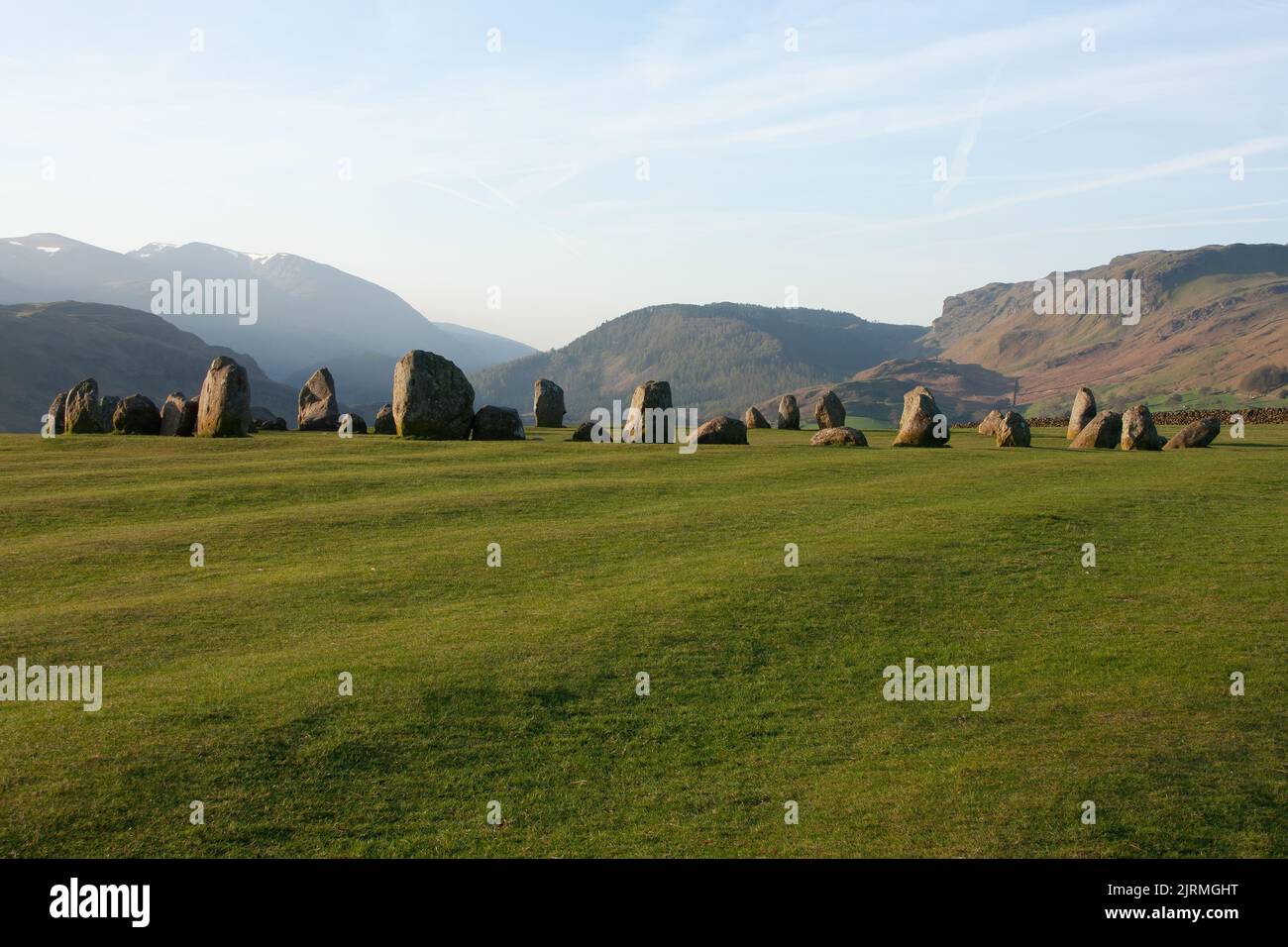 The view of megalithic Castlerigg stone circle in the green field under the blue sky Stock Photo
