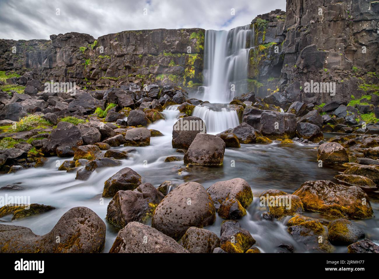 Waterfall Öxararfoss at Thingvellir National Park in Iceland - long time exposure Stock Photo
