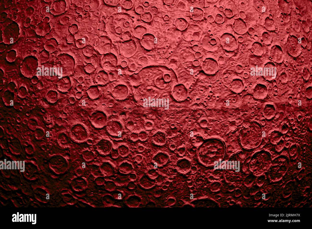 Surface of red planet with impact craters. Model of the Mars planet. Stock Photo