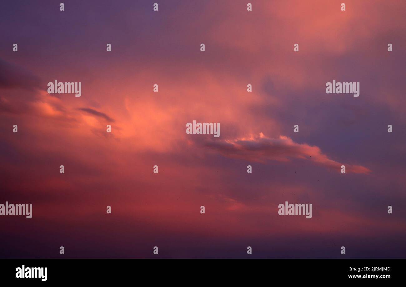 Red clouds at sunset. Dramatic sunset sky Stock Photo - Alamy