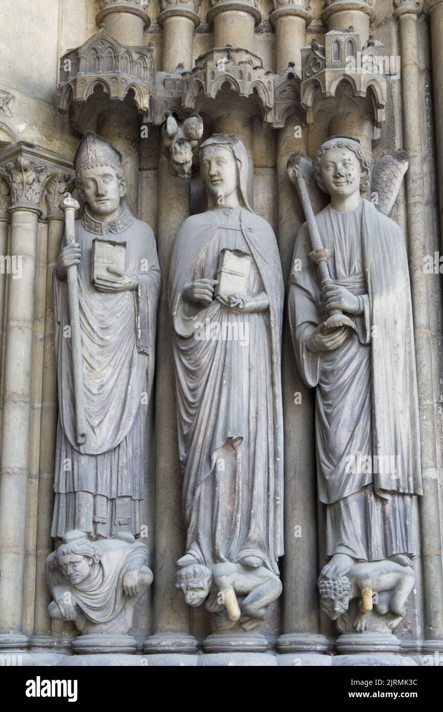 Saint Germain de Paris, Sainte-Genviève and the Archangel Michel - Porch of Saint-Germain l’Auxerrois, Place du Louvre, Paris Stock Photo