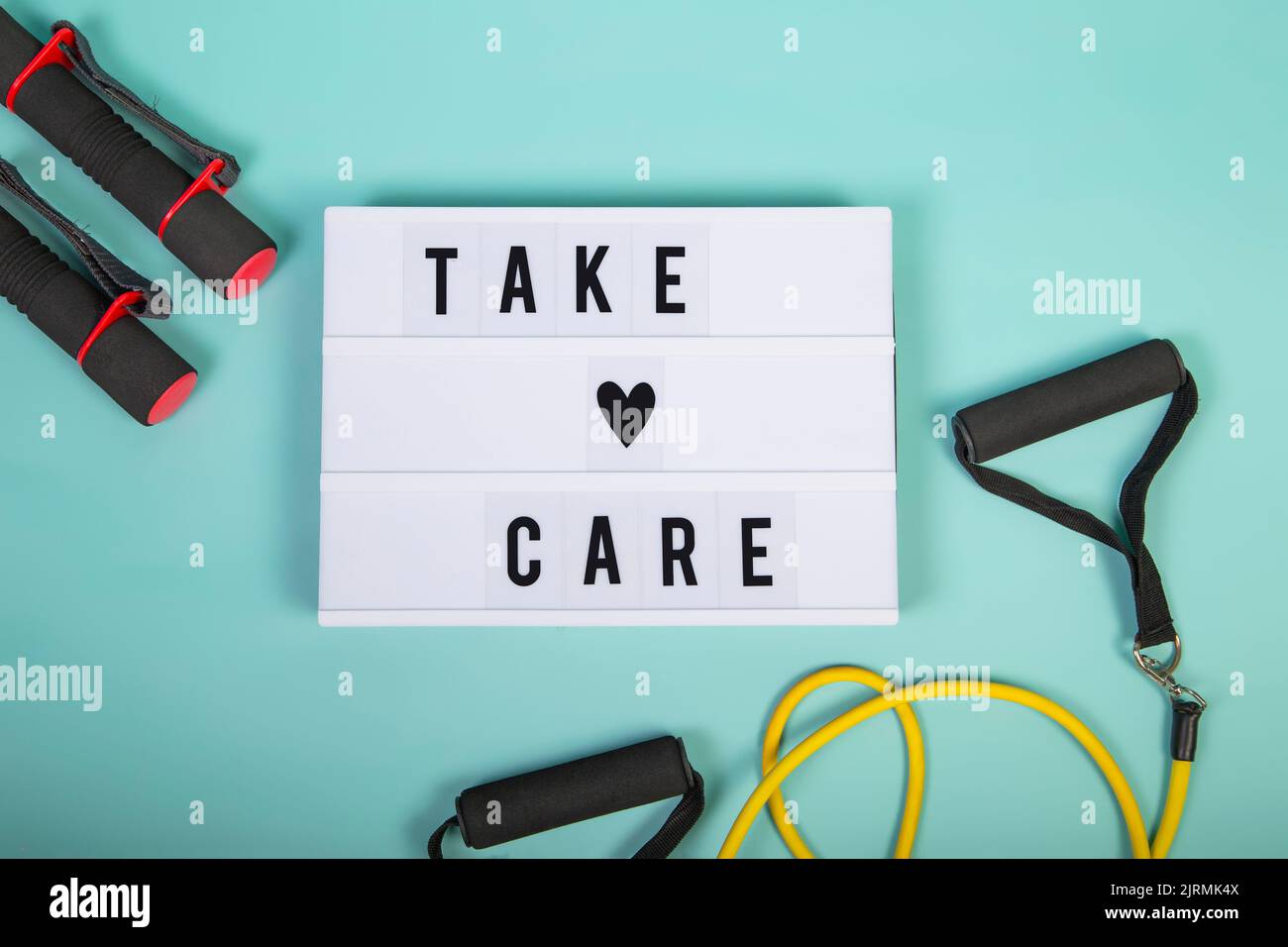 Lightbox with the words 'Take care' on a blue background. Stock Photo