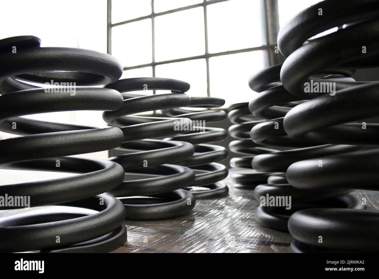 large steel springs inside the factory Stock Photo