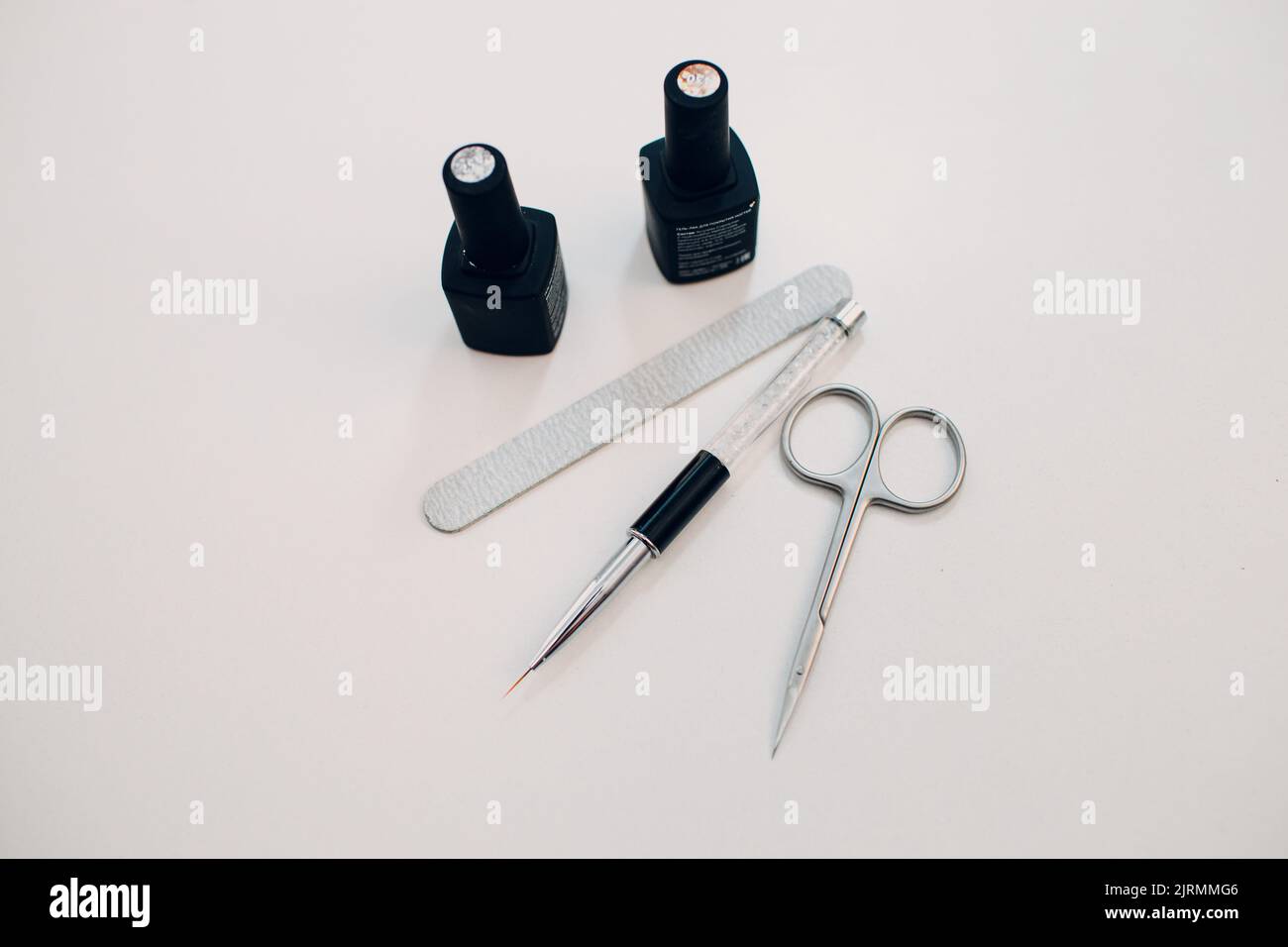 Manicure or pedicure supplies tools on table. Stock Photo