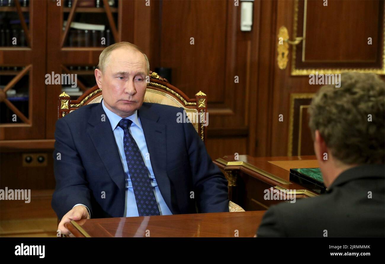 Moscow, Russia. 25th Aug, 2022. Russian President Vladimir Putin holds a face-to-face meeting with the Head of the Federal Taxation Service Daniil Yegorov, right, at the Kremlin, August 25, 2022 in Moscow, Russia. Credit: Mikhail Klimentyev/Kremlin Pool/Alamy Live News Stock Photo