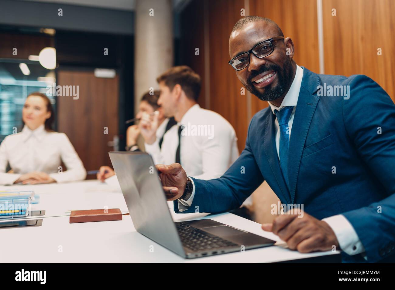 African american black man businessman sitting at table with laptop on ...