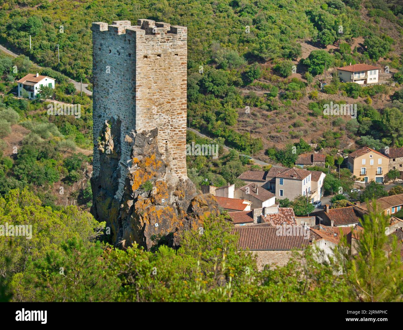 The tower that rises above Roquebrun in southern France Stock Photo