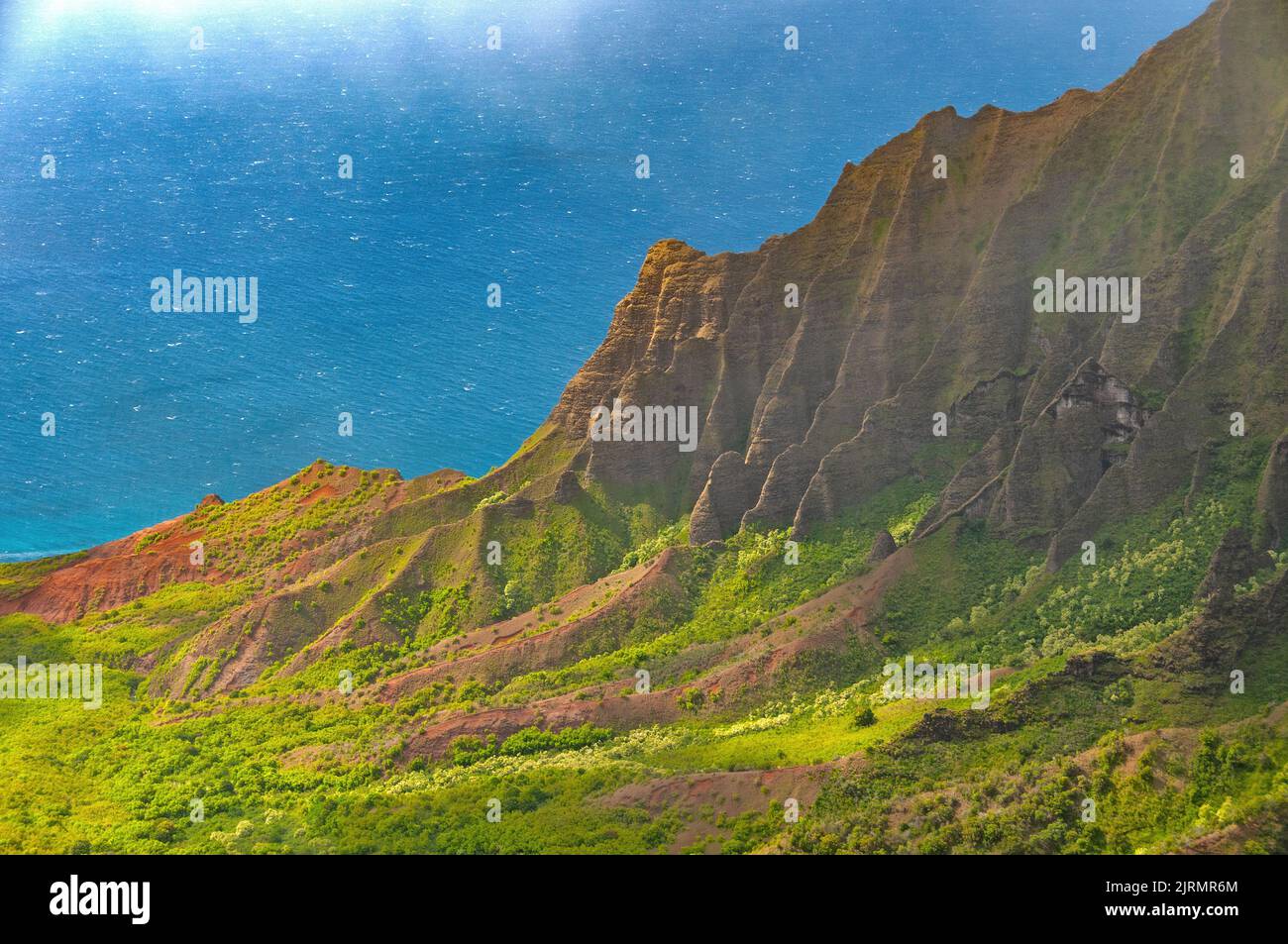 Steep Eroded Cliffs in a Green Coastal Valley in teh Kalalau Valley on Kauai Stock Photo