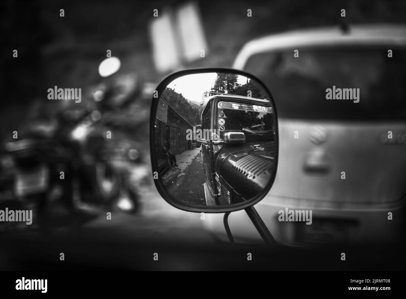Reflection of jeep on side view mirror Stock Photo