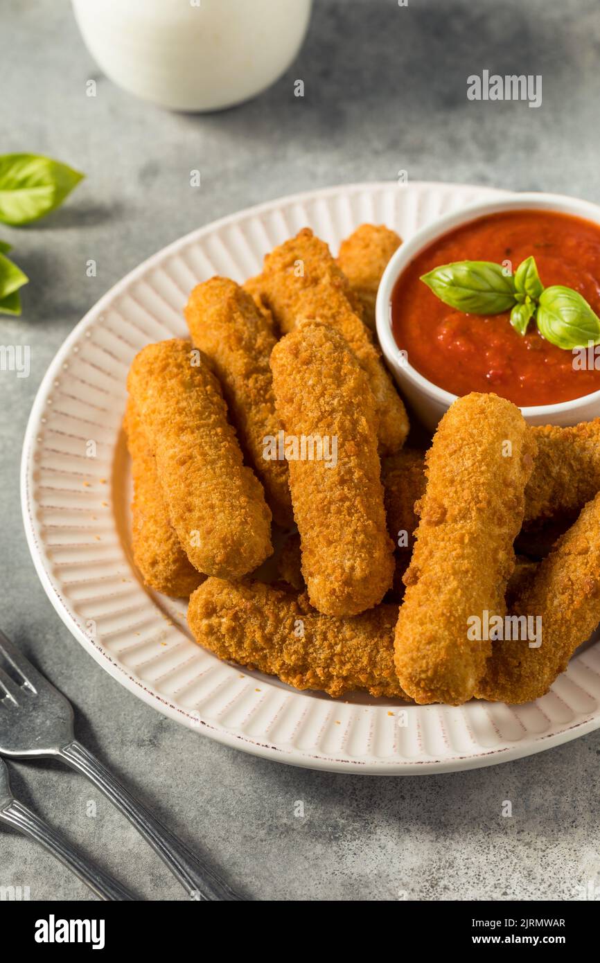 Homemade Deep Fried Mozzarella Sticks with Marinara Sauce Stock Photo