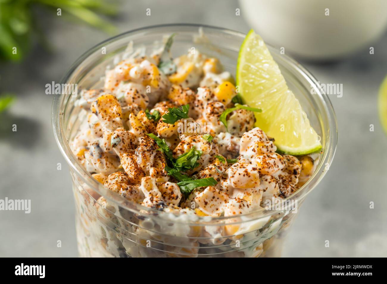 Homemade Corn Elote Esquites in a Cup with Mayo and LIme Stock Photo