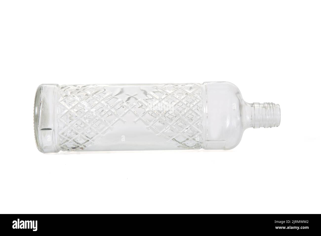 lying down of a glass bottle with textured diagonal stripes isolated on