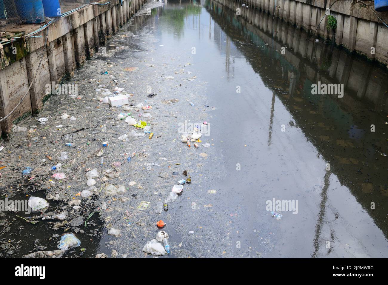 Garbage on waste water in canal Stock Photo