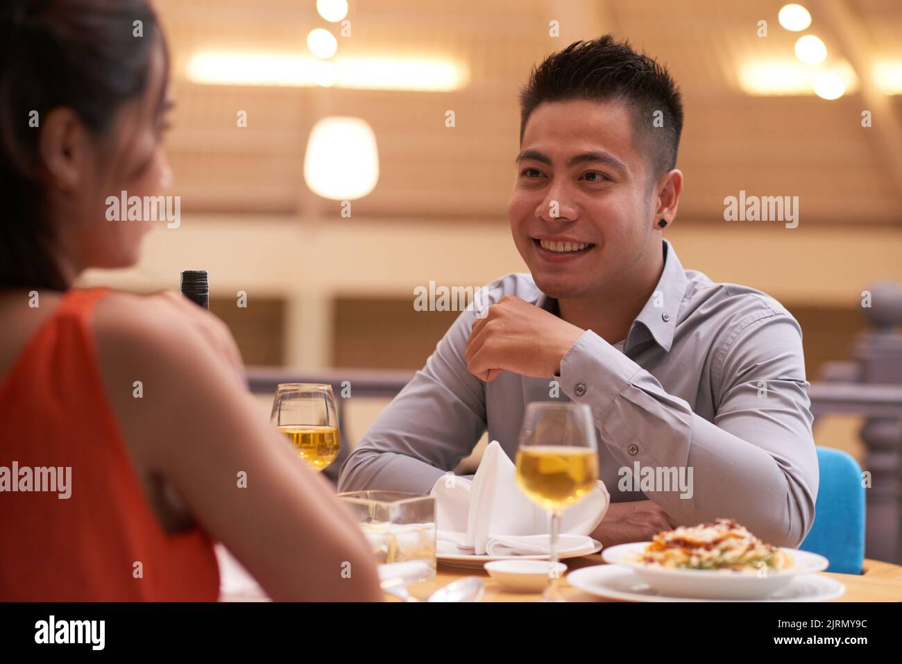 Handsome young man dining in cafe with his girlfriend Stock Photo