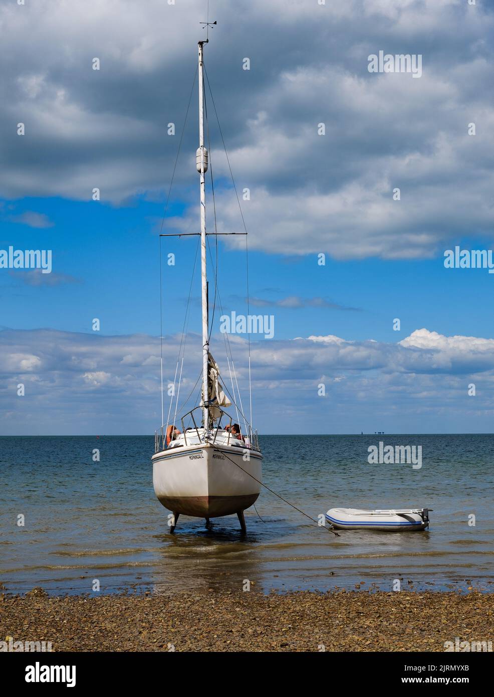 The yacht ‘morning all’ beached at low tide on the shore at Whitstable, Kent. Stock Photo