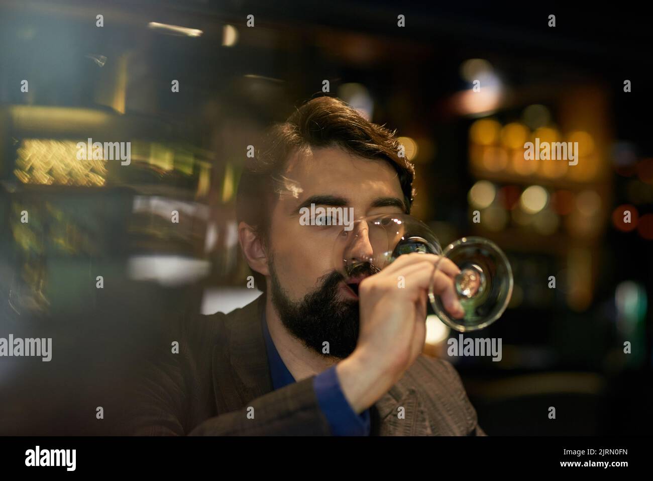Man drinking wine in bar or restaurant Stock Photo