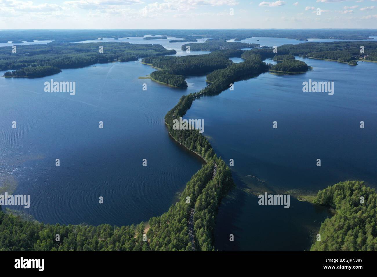 An aerial view of a trail with trees on the sea Stock Photo - Alamy