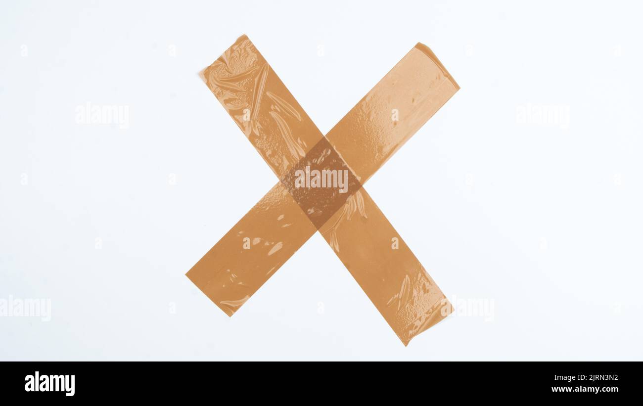 Insulating tape glued to white paper with a cross Stock Photo Alamy